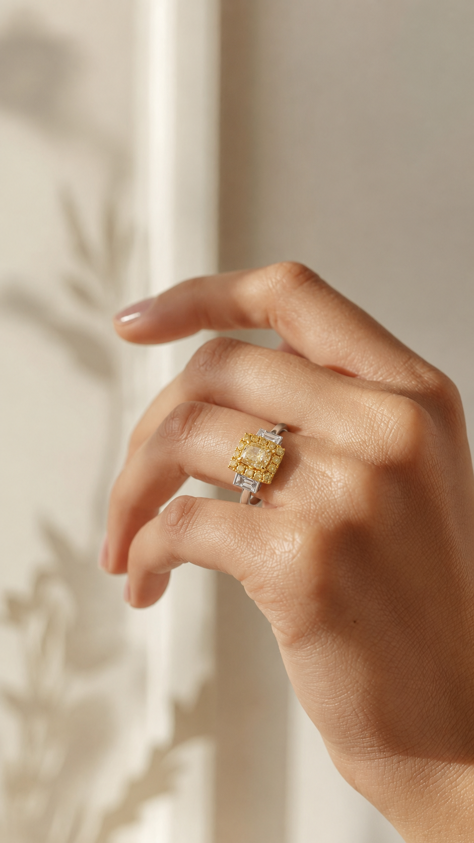Yellow diamond ring on hand